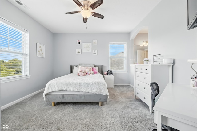 5875 Stroup Dr, Noblesville, IN 46062 - bedroom with light carpet, a ceiling fan, and arched walkways