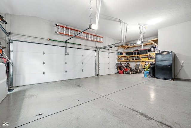 5875 Stroup Dr, Noblesville, IN 46062 - garage featuring freestanding refrigerator and a garage door opener