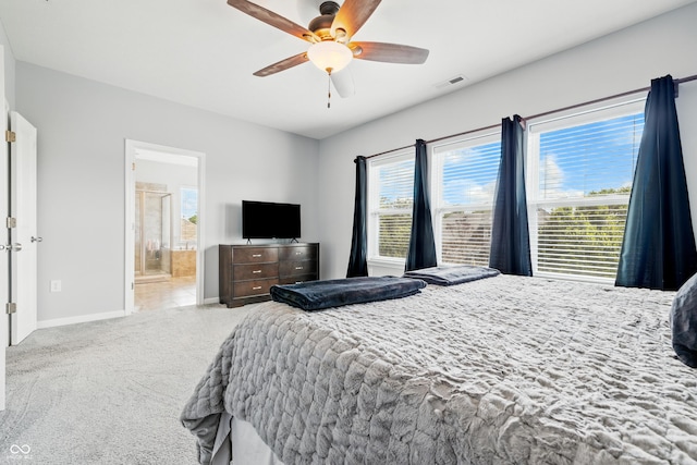 5875 Stroup Dr, Noblesville, IN 46062 - bedroom with carpet, multiple windows, connected bathroom, and ceiling fan
