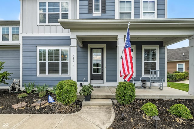 5875 Stroup Dr, Noblesville, IN 46062 - property entrance with a porch and board and batten siding