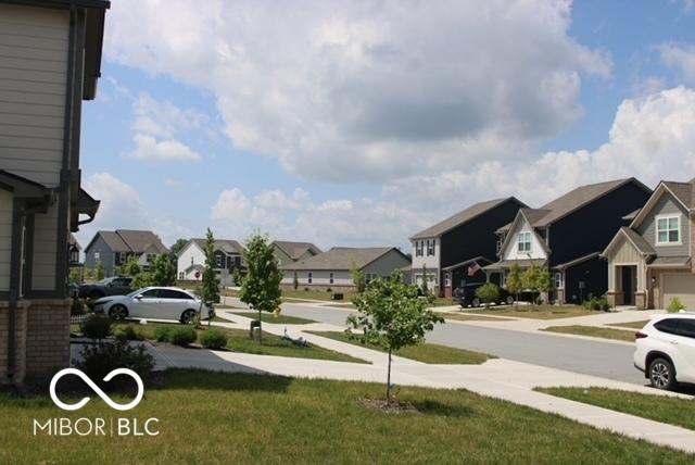 1573 Torrey Ln, Greenwood, IN 46143 - view of green lawn with a residential view