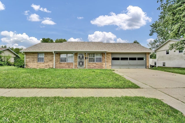 2149 Westline Dr, Columbus, IN 47203 - ranch-style home with a garage, driveway, brick siding, and a front yard