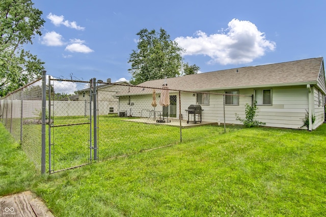 2149 Westline Dr, Columbus, IN 47203 - rear view of house with a gate and roof with shingles