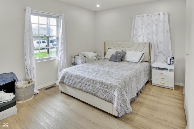 2149 Westline Dr, Columbus, IN 47203 - bedroom with light wood finished floors and recessed lighting