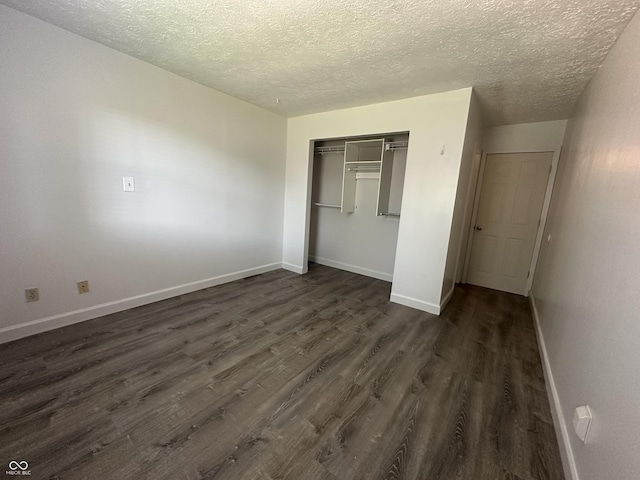 3708 Pleasant Creek Dr, Indianapolis, IN 46227 - unfurnished bedroom with dark wood finished floors, a textured ceiling, and a closet