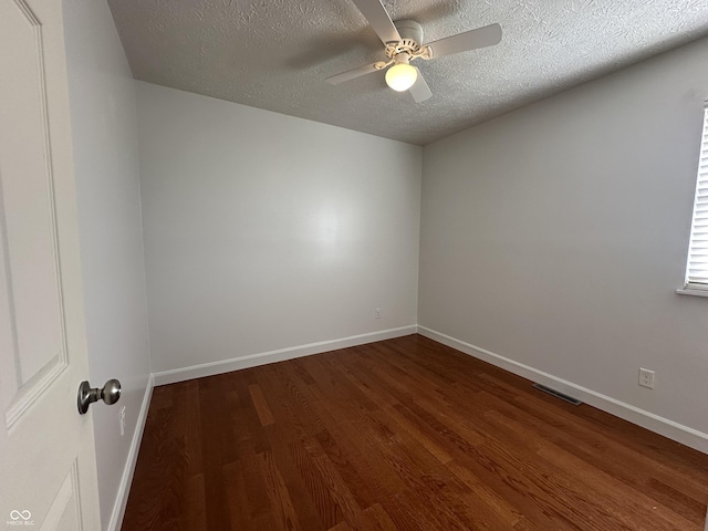3708 Pleasant Creek Dr, Indianapolis, IN 46227 - unfurnished room with dark wood-type flooring, a textured ceiling, and ceiling fan