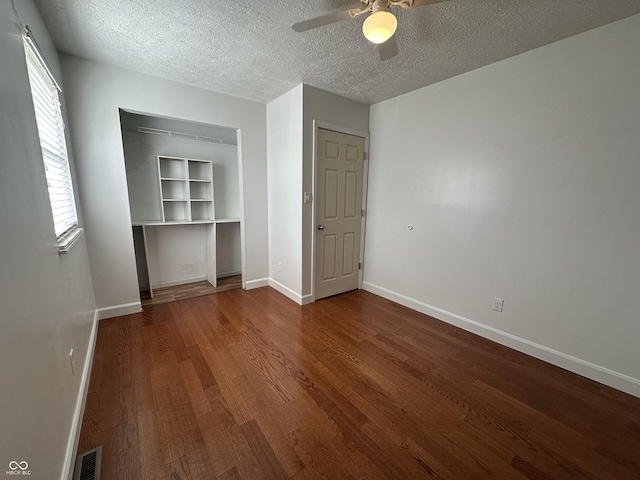 3708 Pleasant Creek Dr, Indianapolis, IN 46227 - unfurnished bedroom featuring wood finished floors, a textured ceiling, ceiling fan, and a closet