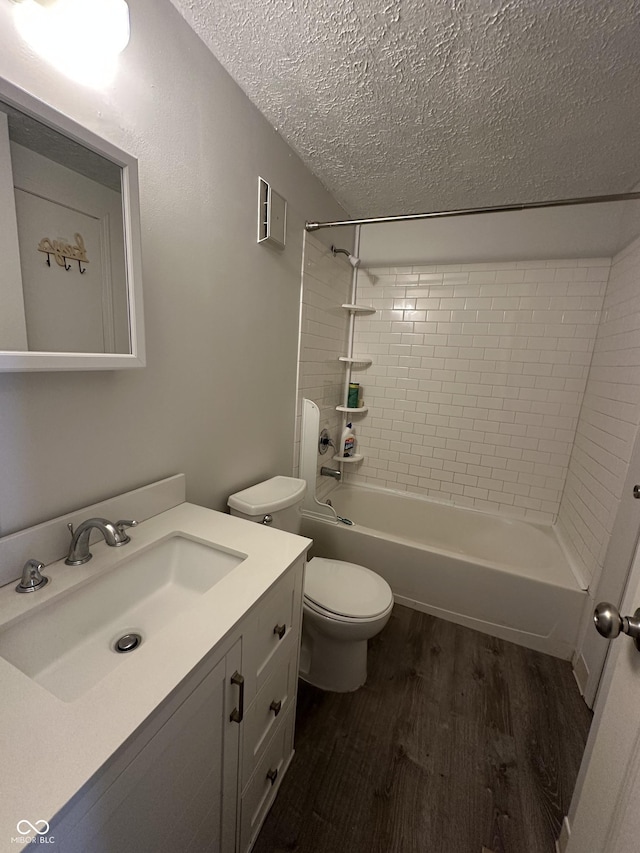 3708 Pleasant Creek Dr, Indianapolis, IN 46227 - bathroom featuring a textured ceiling, wood finished floors, vanity, and shower / bath combination