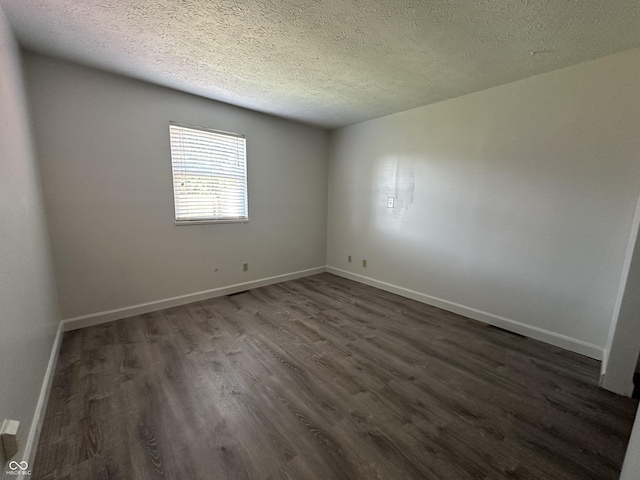 3708 Pleasant Creek Dr, Indianapolis, IN 46227 - empty room with dark wood-type flooring and a textured ceiling