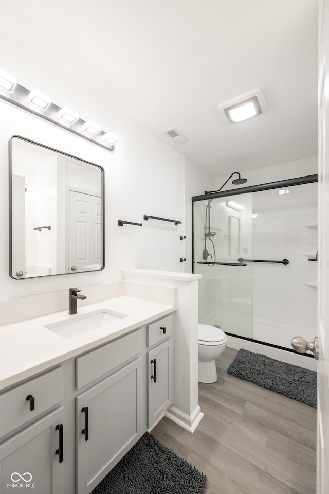 268 Larimar Dr, Whiteland, IN 46184 - bathroom with vanity, a stall shower, and wood finished floors