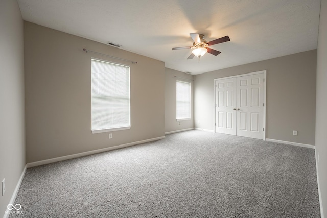 268 Larimar Dr, Whiteland, IN 46184 - unfurnished bedroom with carpet, a closet, and a ceiling fan