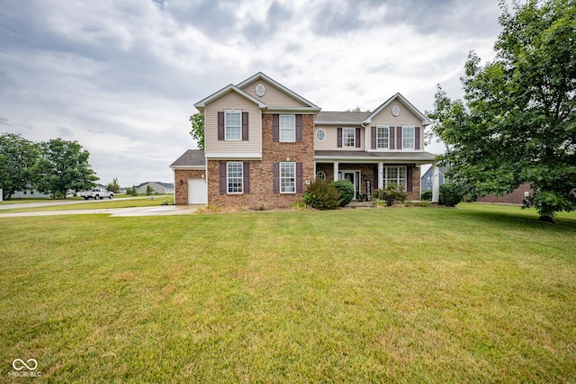 268 Larimar Dr, Whiteland, IN 46184 - view of front of house with brick siding, concrete driveway, covered porch, and a front lawn