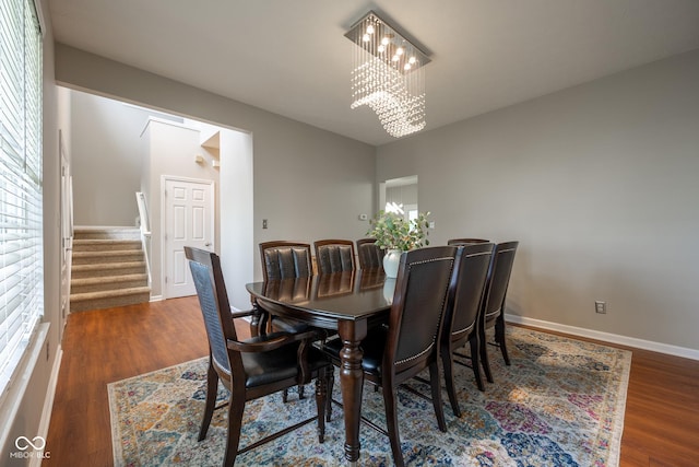 268 Larimar Dr, Whiteland, IN 46184 - dining area with a chandelier, stairway, and wood finished floors