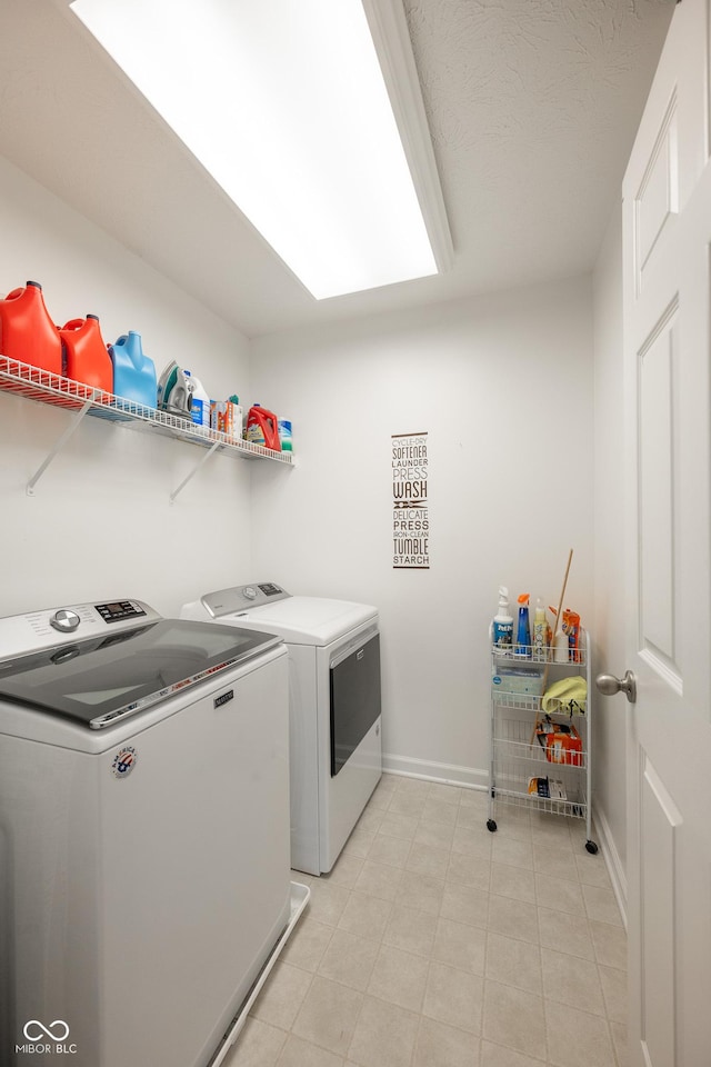 268 Larimar Dr, Whiteland, IN 46184 - laundry area with washing machine and clothes dryer and light tile patterned flooring