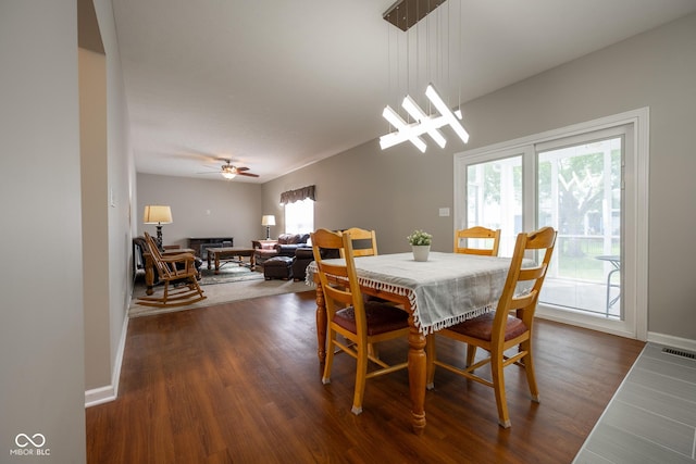 268 Larimar Dr, Whiteland, IN 46184 - dining room featuring dark wood-type flooring, a fireplace, and a ceiling fan
