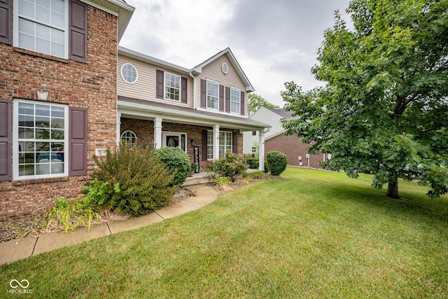 268 Larimar Dr, Whiteland, IN 46184 - view of front facade featuring a front yard and brick siding