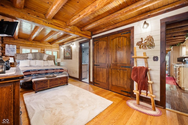 7813 W 50 S, Morgantown, IN 46160 - bedroom featuring a wooden ceiling with exposed beams, light wood-style floors, and log walls