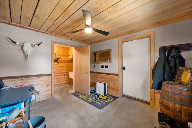 7813 W 50 S, Morgantown, IN 46160 - misc room with wood walls, a ceiling fan, wooden ceiling, concrete flooring, and a wainscoted wall