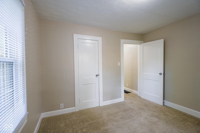 916 E 54th St, Indianapolis, IN 46220 - unfurnished bedroom with carpet and baseboards