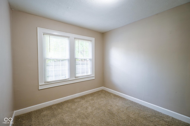 916 E 54th St, Indianapolis, IN 46220 - carpeted spare room featuring baseboards