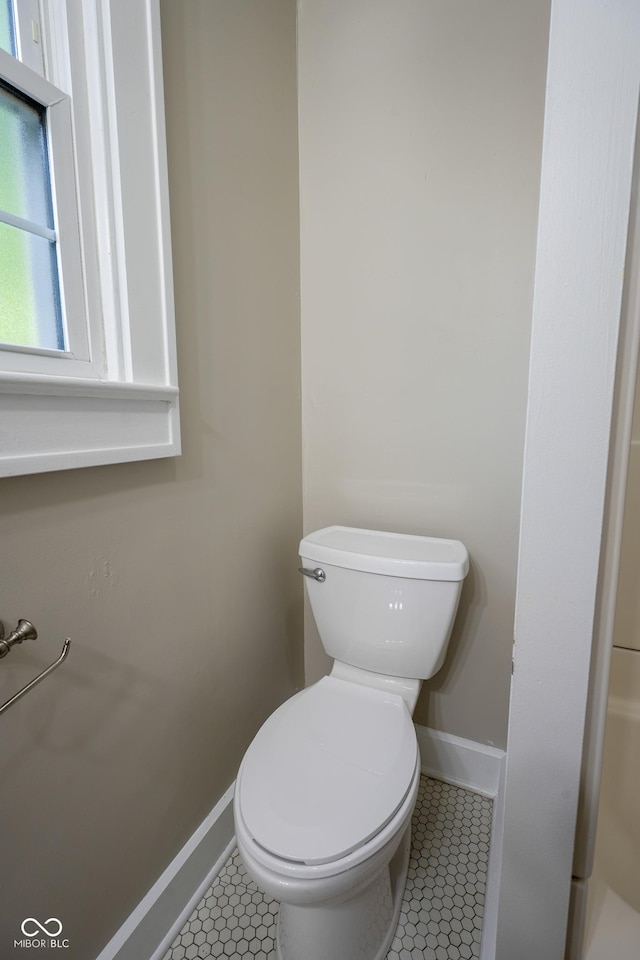 916 E 54th St, Indianapolis, IN 46220 - bathroom featuring baseboards and tile patterned floors