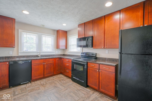 916 E 54th St, Indianapolis, IN 46220 - kitchen with black appliances, dark countertops, recessed lighting, a textured ceiling, and brown cabinetry