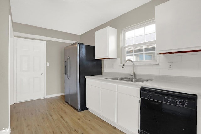 5422 Bluff View Dr, Indianapolis, IN 46217 - kitchen with dishwasher, stainless steel fridge, tasteful backsplash, light wood-style floors, and light countertops
