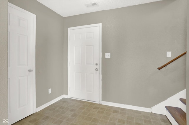 5422 Bluff View Dr, Indianapolis, IN 46217 - foyer entrance featuring tile patterned floors and stairway