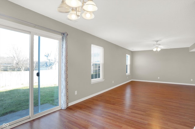 5422 Bluff View Dr, Indianapolis, IN 46217 - empty room featuring a chandelier, wood finished floors, and ceiling fan