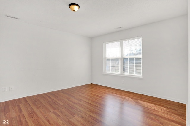 5422 Bluff View Dr, Indianapolis, IN 46217 - empty room featuring baseboards and light wood-style floors