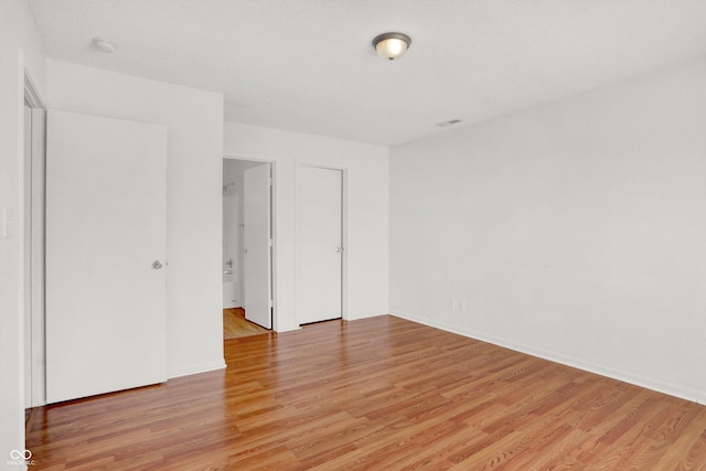 5422 Bluff View Dr, Indianapolis, IN 46217 - unfurnished room with light wood finished floors and a smoke detector