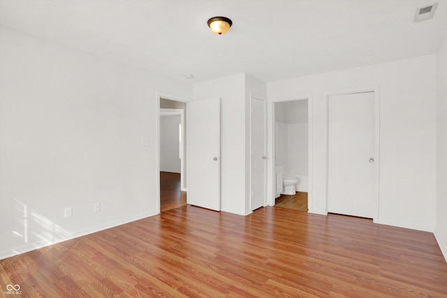 5422 Bluff View Dr, Indianapolis, IN 46217 - unfurnished bedroom featuring light wood-style flooring and ensuite bath