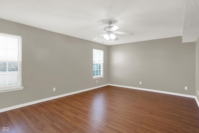 5422 Bluff View Dr, Indianapolis, IN 46217 - empty room with a ceiling fan, wood finished floors, and a textured ceiling