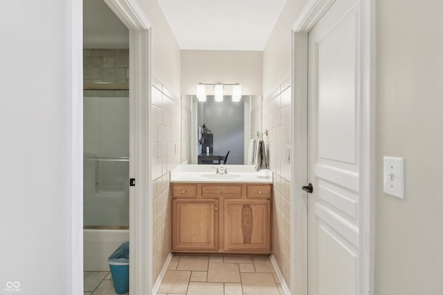 12068 Bayhill Dr, Carmel, IN 46033 - bathroom featuring tile walls, vanity, and tile patterned flooring