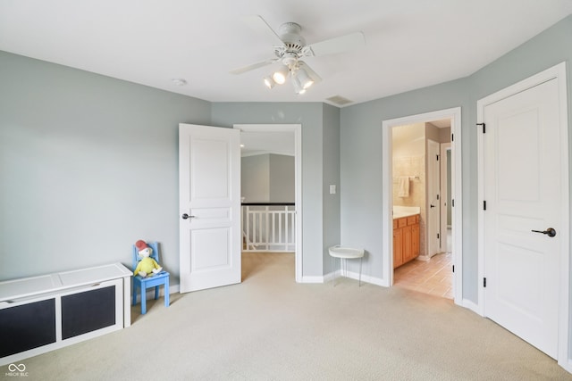 12068 Bayhill Dr, Carmel, IN 46033 - unfurnished bedroom featuring light carpet, ensuite bathroom, and a ceiling fan