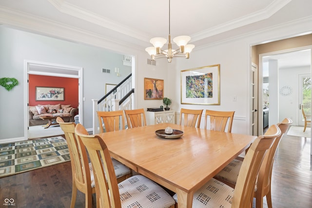 12068 Bayhill Dr, Carmel, IN 46033 - dining room with stairs, wood finished floors, crown molding, and a chandelier