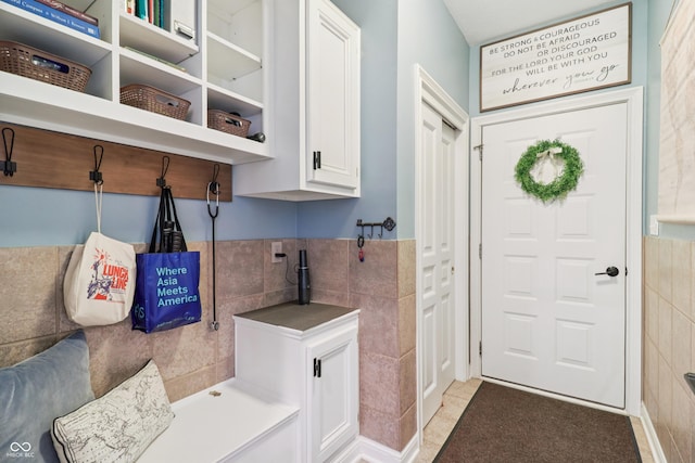 12068 Bayhill Dr, Carmel, IN 46033 - mudroom with tile walls and light tile patterned floors