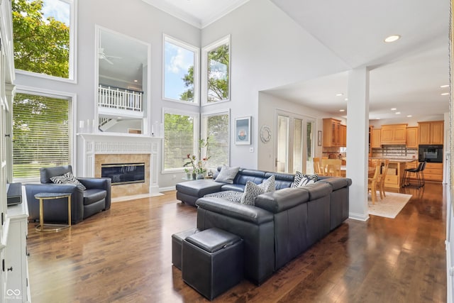 12068 Bayhill Dr, Carmel, IN 46033 - living room featuring a high ceiling, healthy amount of natural light, ceiling fan, a high end fireplace, and recessed lighting