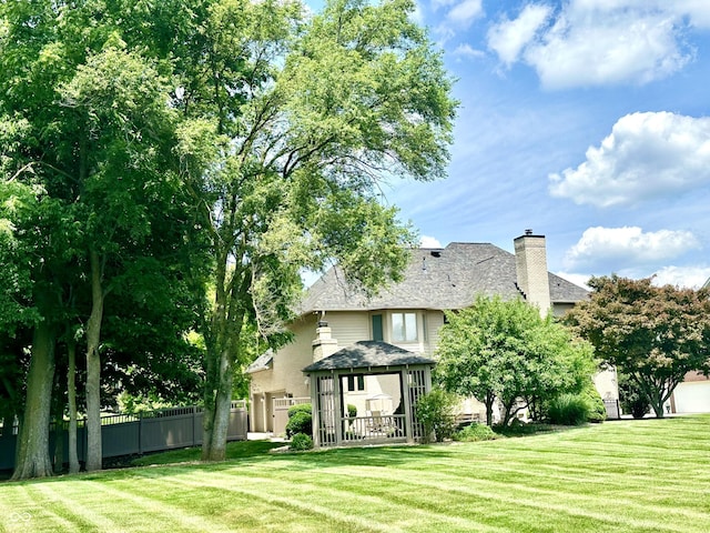 12068 Bayhill Dr, Carmel, IN 46033 - rear view of house featuring a chimney and a gazebo