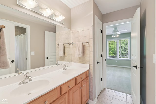 12068 Bayhill Dr, Carmel, IN 46033 - bathroom featuring double vanity, ceiling fan, and tile patterned flooring