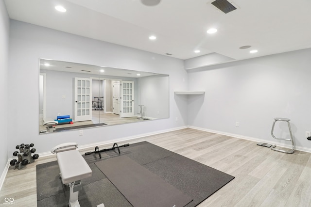12068 Bayhill Dr, Carmel, IN 46033 - exercise room with french doors, wood finished floors, and recessed lighting