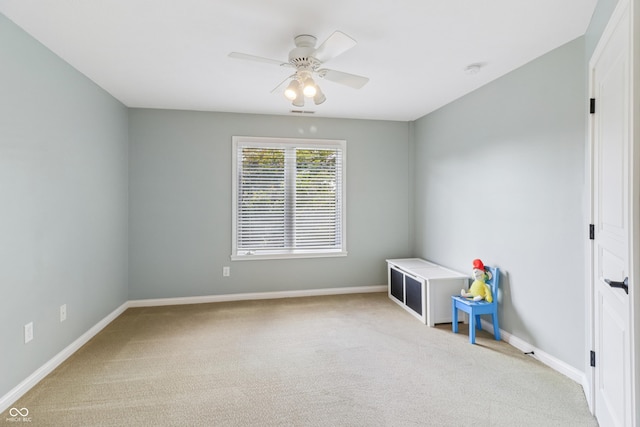 12068 Bayhill Dr, Carmel, IN 46033 - spare room featuring ceiling fan, carpet, and a smoke detector
