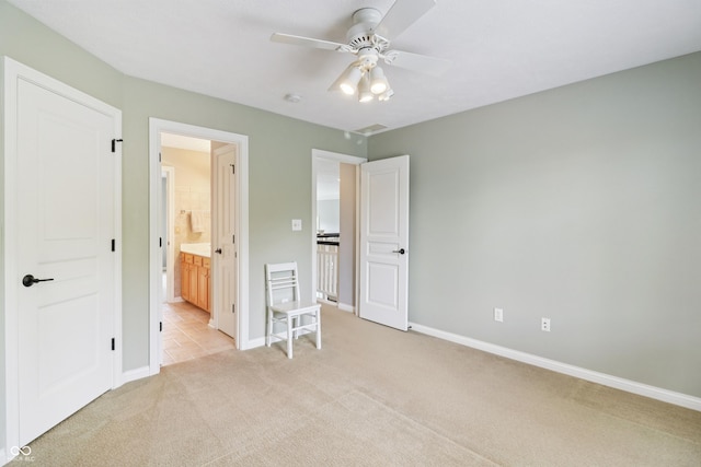 12068 Bayhill Dr, Carmel, IN 46033 - bedroom featuring light colored carpet, ensuite bathroom, and a ceiling fan