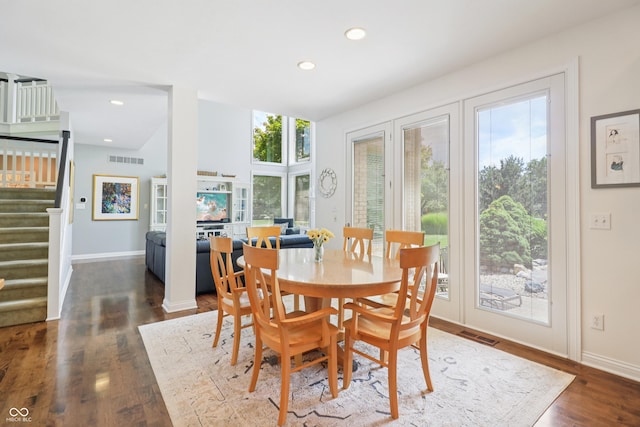 12068 Bayhill Dr, Carmel, IN 46033 - dining room with stairs, dark wood-style flooring, and recessed lighting
