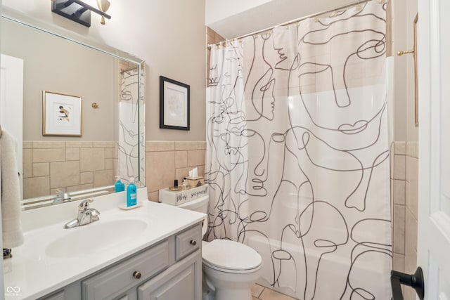 12068 Bayhill Dr, Carmel, IN 46033 - full bathroom featuring tile walls, vanity, shower / tub combo with curtain, and wainscoting