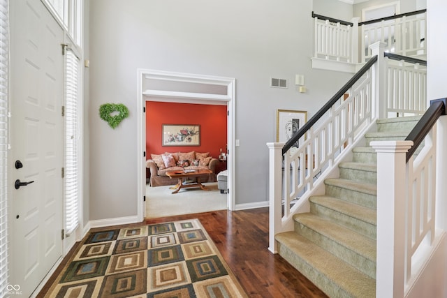 12068 Bayhill Dr, Carmel, IN 46033 - entryway with a towering ceiling, dark wood finished floors, and stairway