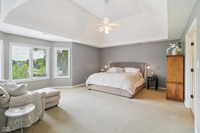 12068 Bayhill Dr, Carmel, IN 46033 - carpeted bedroom featuring a tray ceiling and a ceiling fan