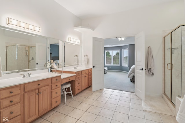 12068 Bayhill Dr, Carmel, IN 46033 - ensuite bathroom featuring double vanity, tile patterned floors, and a shower stall