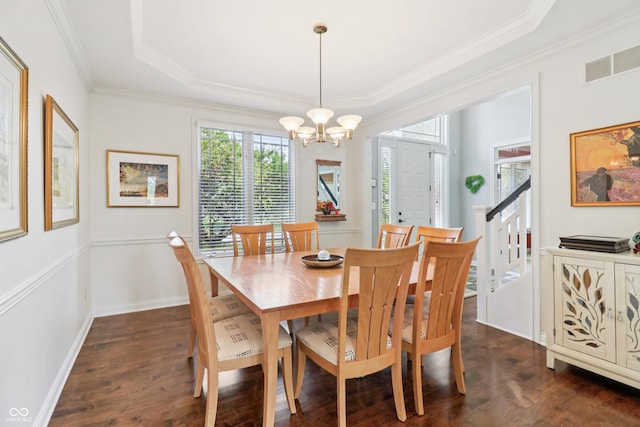 12068 Bayhill Dr, Carmel, IN 46033 - dining area featuring a chandelier, dark wood-style floors, ornamental molding, and a tray ceiling