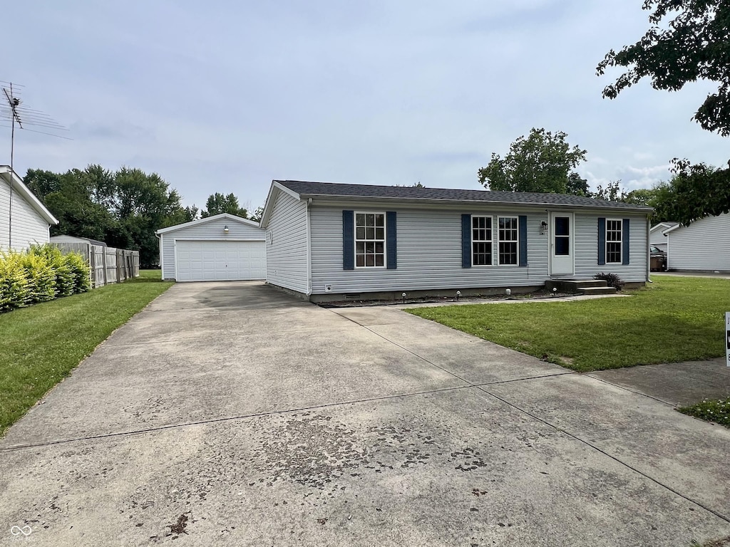 3307 Fall Valley Dr, Columbus, IN 47203 - ranch-style house with an outbuilding, a detached garage, and driveway
